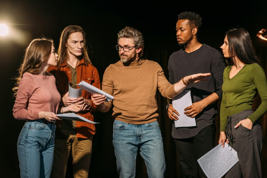 multiethnic-actors-and-actresses-rehearsing-with-theater-director-on-stage.jpg